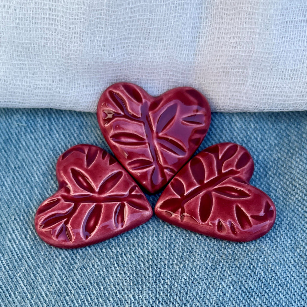 Three raspberry whip leaves on a blue denim background with text about availability.